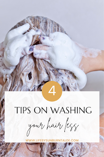 4 Tips on washing your hair less lady washing her hair with lots of shampoo.